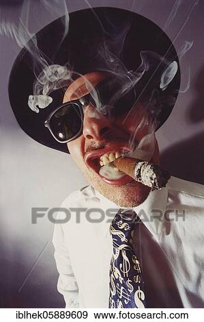 Stock Photo - Gangster, parody, cigar, hat, sunglasses, Berlin, Germany, Europe. Fotosearch