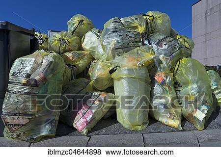 Garbage bags, yellow bags for collection at the street, Bavaria, Germany, Europe View Large Photo Image Stock Photo - Garbage bags, yellow bags for collection at the street, Bavaria, Germany, Europe. Fotosearch