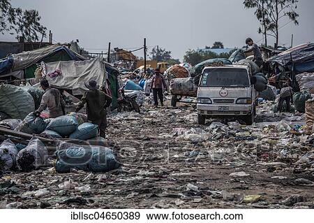 Stock Photo - Garbage collectors on rubbish dump on the outskirts, Phnom Penh, Cambodia, Asia. Fotosearch