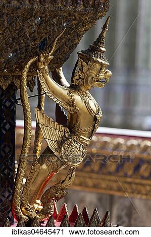 Stock Image - Garuda with Nagas, gilded figure, Ubosot Gallery, Emerald Buddha Temple, Wat Phra Kaeo, Ko Ratanakosin, Bangkok, Thailand, Asia. Fotosearch