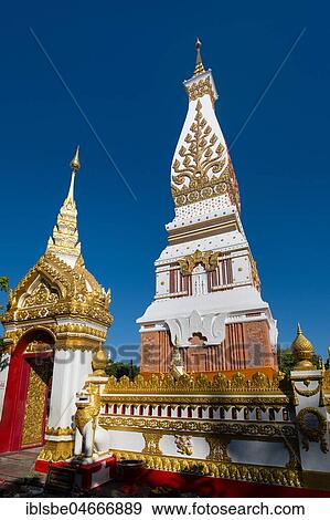 Gilded wall in front of the Chedi of Wat Phra That Phanom, temple complex in Amphoe That Phanom, Nakhon Phanom Province, Isan, Thailand, Asia View Large Photo Image Stock Photo - Gilded wall in front of the Chedi of Wat Phra That Phanom, temple complex in Amphoe That Phanom, Nakhon Phanom Province, Isan, Thailand, Asia. Fotosearch