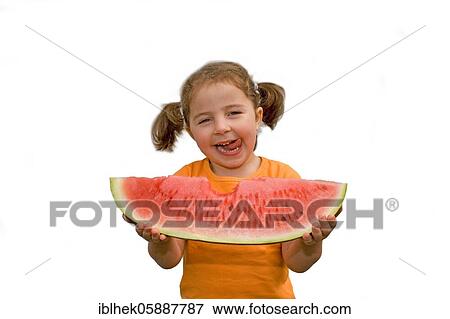 Stock Photo - Girl eating a huge melon, fruit, eat, healthy, Lauda, Germany, Europe. Fotosearch