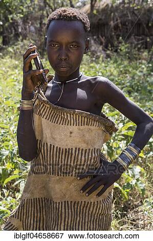 Stock Photo - Girl, portrait, tribe of the Mursi, Southern Nations Nationalities and Peoples' Region, Ethiopia, Africa. Fotosearch