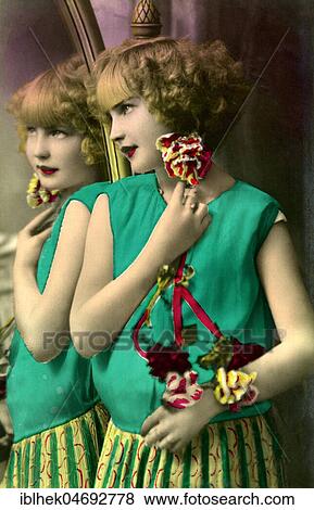 Girl stands in front of a mirror, 1920s, Germany, Europe View Large Photo Image Stock Photo - Girl stands in front of a mirror, 1920s, Germany, Europe. Fotosearch