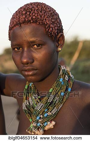 Girl with necklace approx. 16 years, Hamer tribe, portrait, Turmi, region of southern nations, nationalities and peoples, Ethiopia, Africa View Large Photo Image Picture - Girl with necklace approx. 16 years, Hamer tribe, portrait, Turmi, region of southern nations, nationalities and peoples, Ethiopia, Africa. Fotosearch