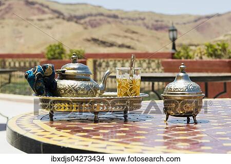 Glas mit Minztee und silberne Teekanne, Marokko, Afrika View Large Photo Image Picture - Glas mit Minztee und silberne Teekanne, Marokko, Afrika. Fotosearch