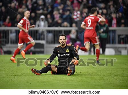Goalkeeper Roman Bürki Borussia Dortmund disappointed after conceding goal, Bayern players cheer in the background, Allianz Arena, Munich, Bavaria, Germany, Europe View Large Photo Image Stock Photograph - Goalkeeper Roman Bürki Borussia Dortmund disappointed after conceding goal, Bayern players cheer in the background, Allianz Arena, Munich, Bavaria, Germany, Europe. Fotosearch