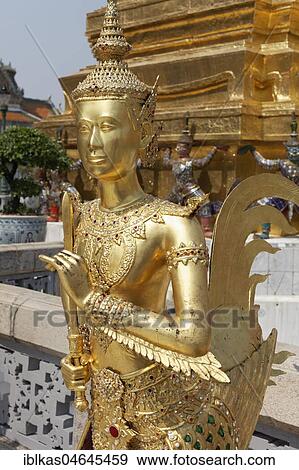 Stock Photo - Gold plated statue Theppaksi, mythical Buddhist figure, half woman, half bird, Wat Phra Kaeo, Ko Ratanakosin, Bangkok, Thailand, Asia. Fotosearch