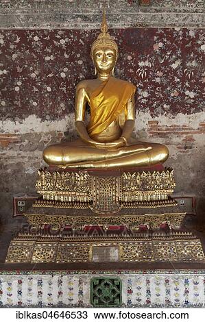 Golden Buddha statue in meditation posture, on decorated pedestal, Phra Rabieng Kot, Wat Suhtat, royal temple, Phra Nakhon, Bangkok, Thailand, Asia View Large Photo Image Stock Image - Golden Buddha statue in meditation posture, on decorated pedestal, Phra Rabieng Kot, Wat Suhtat, royal temple, Phra Nakhon, Bangkok, Thailand, Asia. Fotosearch