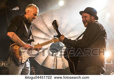 Gregi Heini, guitarist and the Swiss singer and songwriter Lukas Linder alias Henrik Belden with band at the record baptism live in the Schüür Lucerne, Switzerland, Europe View Large Photo Image Stock Image - Gregi Heini, guitarist and the Swiss singer and songwriter Lukas Linder alias Henrik Belden with band at the record baptism live in the Schüür Lucerne, Switzerland, Europe. Fotosearch