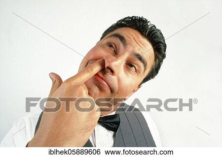 Grimace, man picks his nose, Berlin, Germany, Europe View Large Photo Image Stock Photograph - Grimace, man picks his nose, Berlin, Germany, Europe. Fotosearch