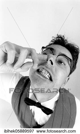 Grimace, man picks his nose, disgusting, Berlin, Germany, Europe View Large Photo Image Stock Photo - Grimace, man picks his nose, disgusting, Berlin, Germany, Europe. Fotosearch