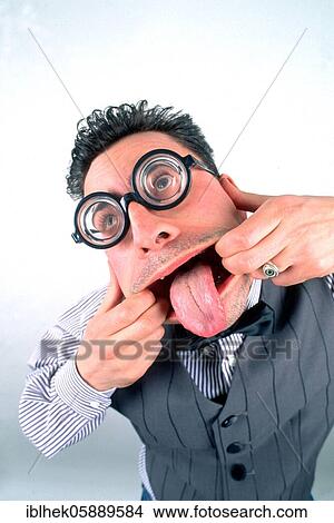 Picture - Grimace, man sticks out his tongue. Fotosearch