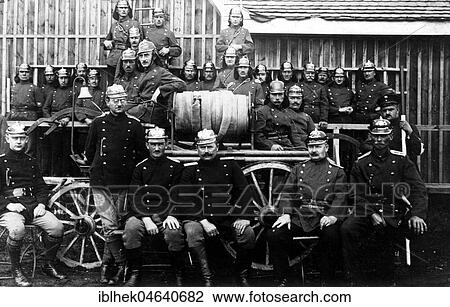 Stock Image - Group picture, firefighters with fire truck, 1920s, exact location unknown, Germany, Europe. Fotosearch
