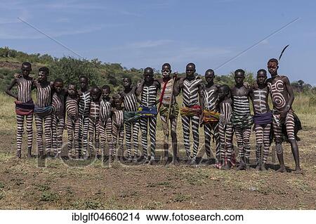 Picture - Group picture of boys and young men with typical body paintings, tribe of the Mursi, Southern Nations Nationalities and Peoples' Region, Ethiopia, Africa. Fotosearch