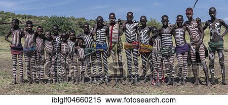 Group picture of boys and young men with typical body paintings, tribe of the Mursi, Southern Nations Nationalities and Peoples' Region, Ethiopia, Africa View Large Photo Image Stock Photography - Group picture of boys and young men with typical body paintings, tribe of the Mursi, Southern Nations Nationalities and Peoples' Region, Ethiopia, Africa. Fotosearch