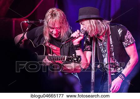 Stock Photo - Guitarist Leo Leoni and singer Nic Maeder from the Swiss rock band Gotthard live in the Schüür Luzern, Switzerland, Europe. Fotosearch