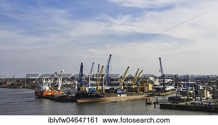 Hamburg harbour on the Elbe river, container ship is being loaded, container terminal, container cranes, Hamburg, Germany, Europe View Large Photo Image Stock Image - Hamburg harbour on the Elbe river, container ship is being loaded, container terminal, container cranes, Hamburg, Germany, Europe. Fotosearch
