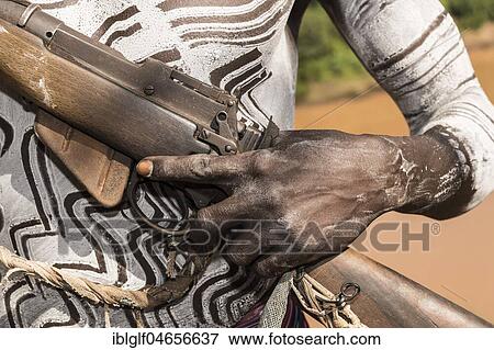 Hand of a warrior on rifle, Karo tribe, Southern Nations Nationalities and Peoples' Region, Ethiopia, Africa View Large Photo Image Stock Photo - Hand of a warrior on rifle, Karo tribe, Southern Nations Nationalities and Peoples' Region, Ethiopia, Africa. Fotosearch