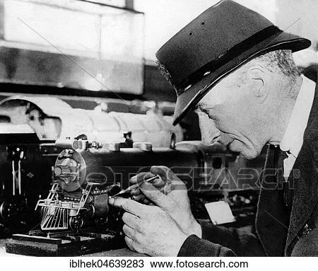 Handicraft, man repairs miniature railway, 1950s, exact place unknown, Germany, Europe View Large Photo Image Stock Image - Handicraft, man repairs miniature railway, 1950s, exact place unknown, Germany, Europe. Fotosearch