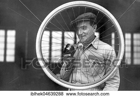 Stock Photo - Handicraft, man with bicycle tyre, 1920s, exact place unknown, Germany, Europe. Fotosearch