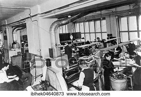 Stock Image - Handicraft, women working in the textile industry, 1940s, Germany, Europe. Fotosearch