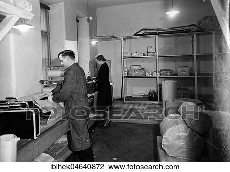 Stock Image - Handicraft, workers packing, 1940s, Germany, Europe. Fotosearch