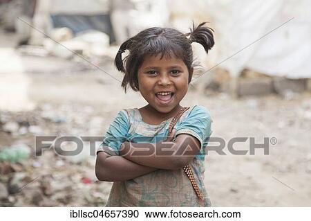 Happy little girl in the slum at the Ghazipur garbage dump, New Delhi, India, Asia View Large Photo Image Stock Image - Happy little girl in the slum at the Ghazipur garbage dump, New Delhi, India, Asia. Fotosearch