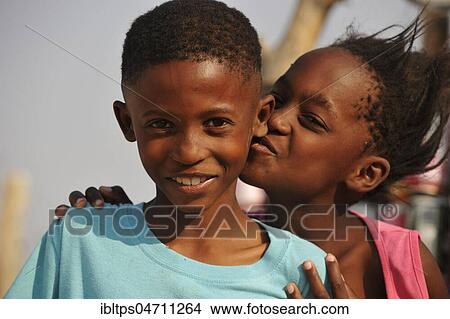 Picture - Happy siblings, boy and girl, portrait, near Spitzkoppe, Erongo region, Damaraland, Namibia, Africa. Fotosearch
