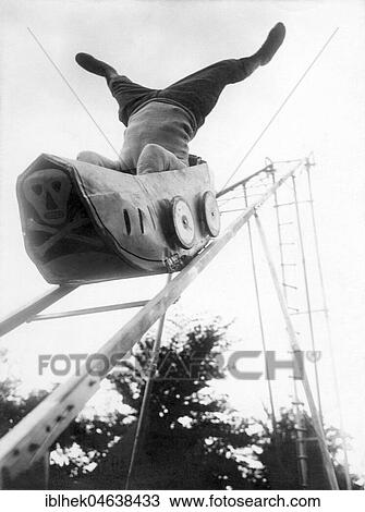 Stock Image - Headstand on roller coaster, ca. 1923, 1920s, exact location unknown, Germany, Europe. Fotosearch