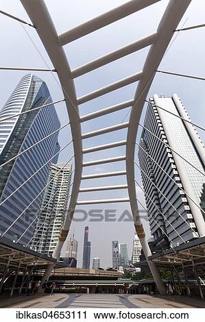 High-rise buildings in the business district Sathon and pedestrian bridge to BTS Skytrain station Chong Nonsi, Sathon, Bangkok, Thailand, Asia View Large Photo Image Stock Image - High-rise buildings in the business district Sathon and pedestrian bridge to BTS Skytrain station Chong Nonsi, Sathon, Bangkok, Thailand, Asia. Fotosearch