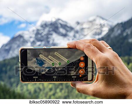 Hiker checks mountain peaks with the Peak Lens smartphone app, Gesäuse National Park, Styria, Austria, Europe View Large Photo Image Stock Image - Hiker checks mountain peaks with the Peak Lens smartphone app, Gesäuse National Park, Styria, Austria, Europe. Fotosearch