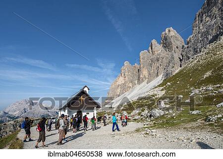 Hikers at the chapel of Cappella degli Alpini, hiking trail around the Three Peaks of Lavaredo, Sexten Dolomites, South Tyrol, Trentino-South Tyrol, Alto-Adige, Italy, Europe View Large Photo Image Stock Photo - Hikers at the chapel of Cappella degli Alpini, hiking trail around the Three Peaks of Lavaredo, Sexten Dolomites, South Tyrol, Trentino-South Tyrol, Alto-Adige, Italy, Europe. Fotosearch