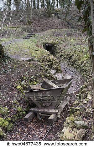 Stock Photography - Hill of Vauquois, iron lorry on rail for ammunition transport, at the back tunnel entrance, First World War, near Verdun, Vauquois, Grand Est, France, Europe. Fotosearch
