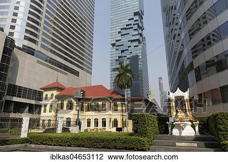 Historical villa and Hindu shrine between high-rise buildings, luxury hotel W Bangkok and Maha Nakhon Building, Bang Rak, Bangkok, Thailand, Asia View Large Photo Image Stock Image - Historical villa and Hindu shrine between high-rise buildings, luxury hotel W Bangkok and Maha Nakhon Building, Bang Rak, Bangkok, Thailand, Asia. Fotosearch