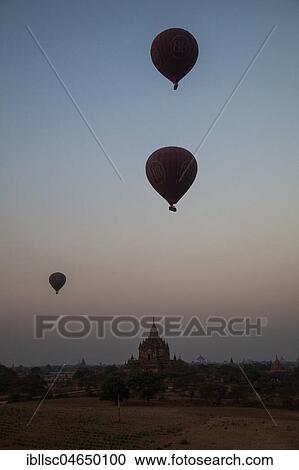 Hot air balloons at sunrise over temples and pagodas, Bagan, Mandalay, Myanmar, Asia View Large Photo Image Stock Image - Hot air balloons at sunrise over temples and pagodas, Bagan, Mandalay, Myanmar, Asia. Fotosearch