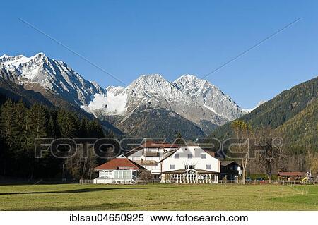 Stock Photography - Hotel Bad Salomonsbrunn, Bagni di Salomone, Rieserfernergruppe with mountains Magerstein amd Hochgall, Rieser-Ferner-Ahrn Nature Park, Antholz Obertal, Anterselva di Sopra, Antholz Valley, South Tyrol, Alto Adige, Italy, Europe. Fotosearch