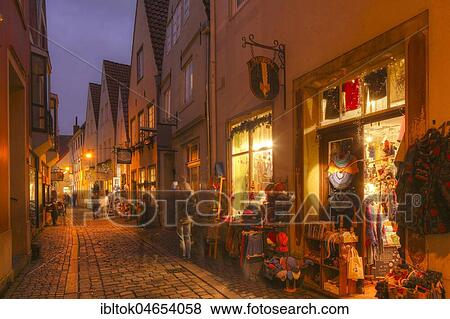 Houses and shops with Christmas lights at dusk, Schnoorviertel, Bremen, Germany, Europe View Large Photo Image Stock Photo - Houses and shops with Christmas lights at dusk, Schnoorviertel, Bremen, Germany, Europe. Fotosearch