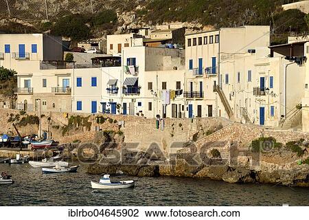 Stock Image - Houses at the port of Levanzo, Levanzo Island, Egadic Islands, Italy, Europe. Fotosearch