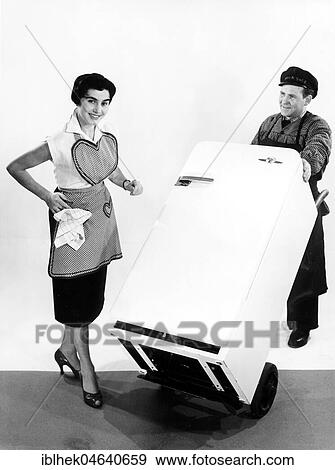 Housewife and supplier, a new refrigerator is delivered, 1950s, exact location unknown, Germany, Europe View Large Photo Image Stock Photo - Housewife and supplier, a new refrigerator is delivered, 1950s, exact location unknown, Germany, Europe. Fotosearch