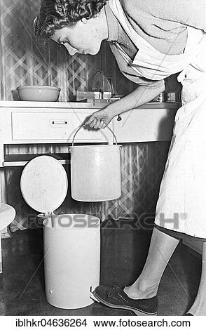 Housewife empties the trash can, ca. 1960s, Berlin, Germany, Europe View Large Photo Image Picture - Housewife empties the trash can, ca. 1960s, Berlin, Germany, Europe. Fotosearch