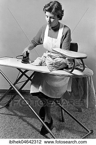 Stock Image - Housewife ironing, 1950s, Germany, Europe. Fotosearch