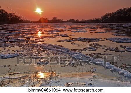 Ice run, small ice floes on the Elbe at sunset, Biosphere Reserve Middle Elbe, Dessau-Roßlau, Saxony-Anhalt, Germany, Europe View Large Photo Image Picture - Ice run, small ice floes on the Elbe at sunset, Biosphere Reserve Middle Elbe, Dessau-Roßlau, Saxony-Anhalt, Germany, Europe. Fotosearch