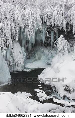 Stock Image - Iced landscape in winter, frozen waterfall, Plitvice Lakes National Park, Plitvice, Croatia, Europe. Fotosearch