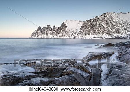 Stock Image - Icy coastal landscape on dusk, Tungeneset, Senja, Norway, Europe. Fotosearch