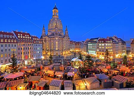 Stock Image - Illuminated Christmas market at the Church of Our Lady, twilight, Dresden, Saxony, Germany, Europe. Fotosearch