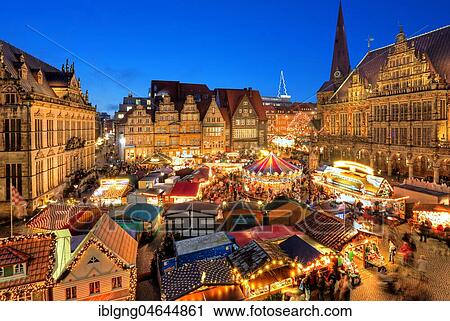 Illuminated Christmas market on the town hall square, in front of town houses, tower of the Liebfrauenkirche and town hall, evening twilight, Bremen, Germany, Europe View Large Photo Image Stock Image - Illuminated Christmas market on the town hall square, in front of town houses, tower of the Liebfrauenkirche and town hall, evening twilight, Bremen, Germany, Europe. Fotosearch