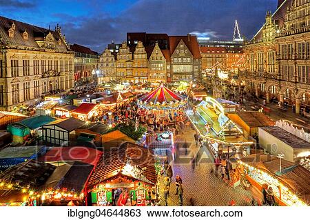 Illuminated Christmas market on the town hall square, in front of town houses, tower of the Liebfrauenkirche and town hall, evening twilight, Bremen, Germany, Europe View Large Photo Image Stock Image - Illuminated Christmas market on the town hall square, in front of town houses, tower of the Liebfrauenkirche and town hall, evening twilight, Bremen, Germany, Europe. Fotosearch