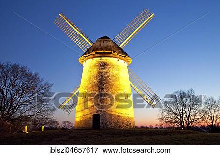 Stock Photo - Illuminated Egelsbergmühle, historical windmill, at dusk, Krefeld, Lower Rhine, North Rhine-Westphalia, Germany, Europe. Fotosearch