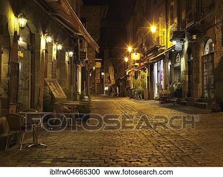 Illuminated Old Town lane at night, with restaurants, Dinan, Cotes-d'Armor, Brittany, France, Europe View Large Photo Image Stock Image - Illuminated Old Town lane at night, with restaurants, Dinan, Cotes-d'Armor, Brittany, France, Europe. Fotosearch